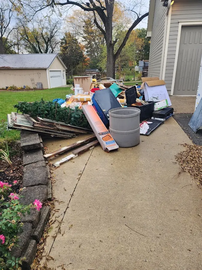 Dumpster being loaded with debris for Demolition Dumpster Rental in Avon